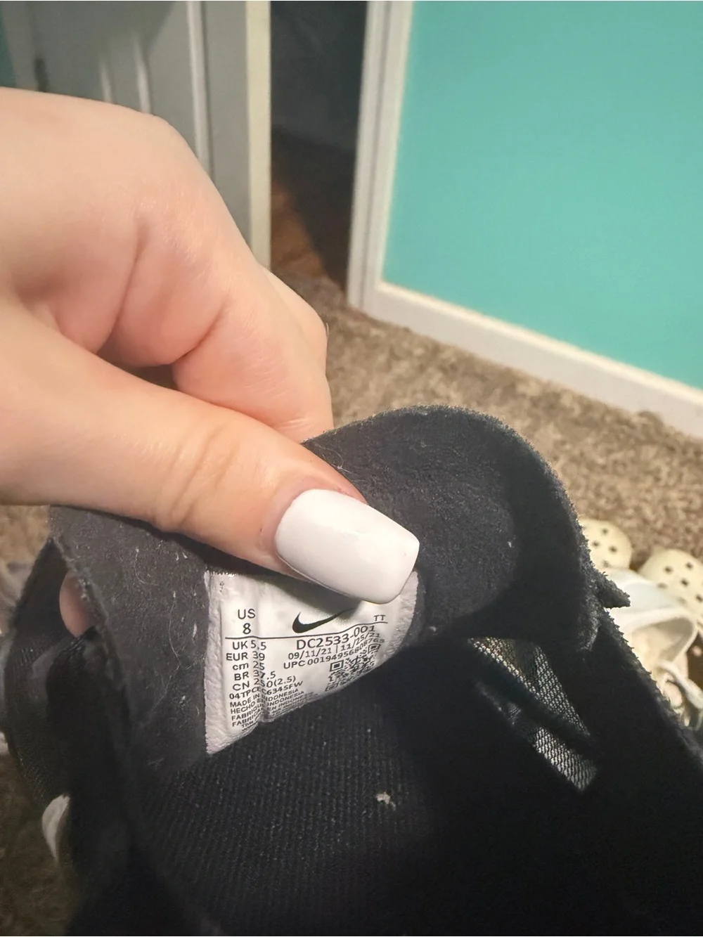 Nike Men’s Black Sneakers with White Swoosh